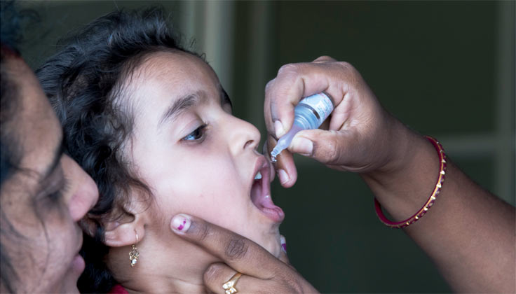 Child receiving a polio vaccination