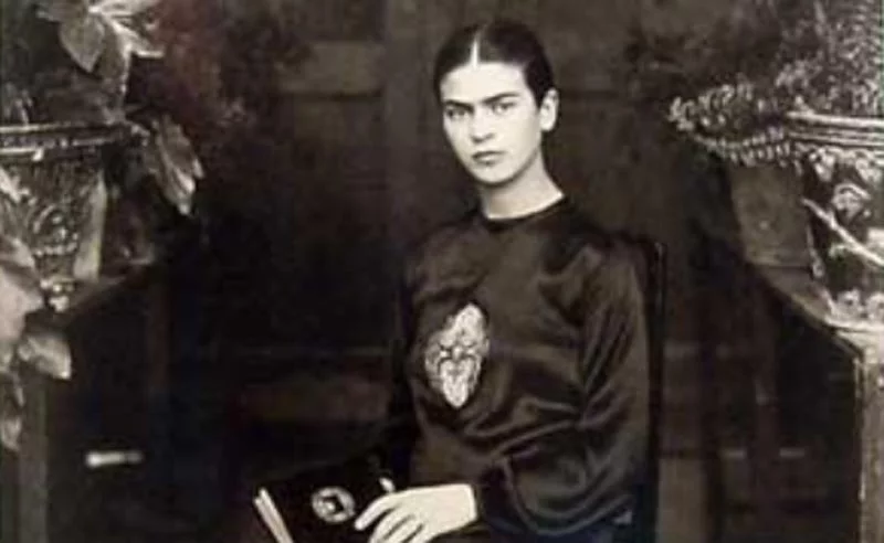 Frida Kahlo posing for a portrait in 1932
