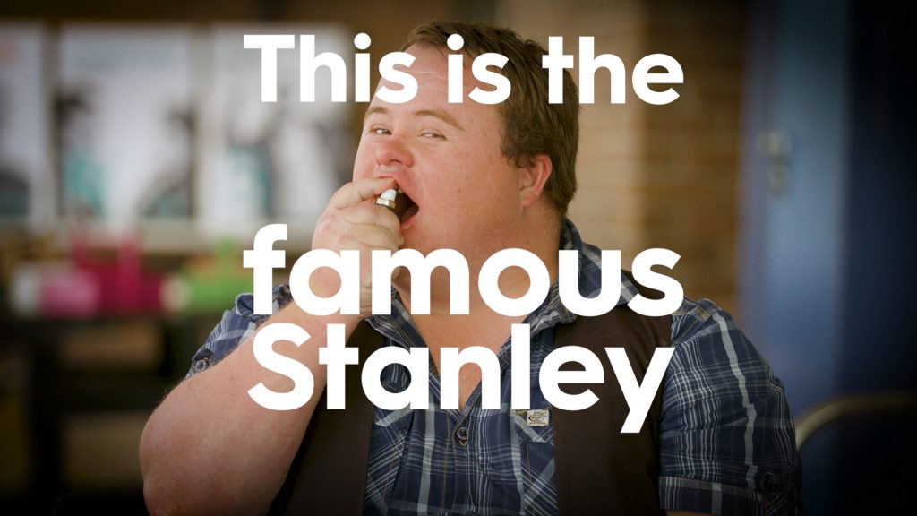 Stanley using a breath freshener with the words 'This is the famous Stanley' written over the top