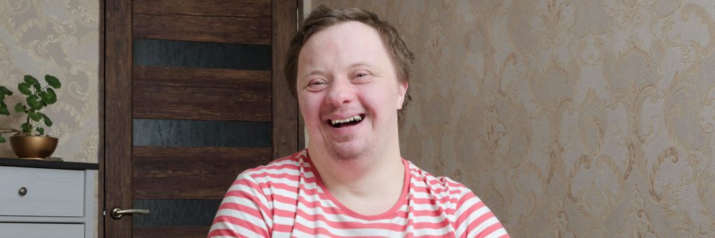 Man with Down syndrome smiling