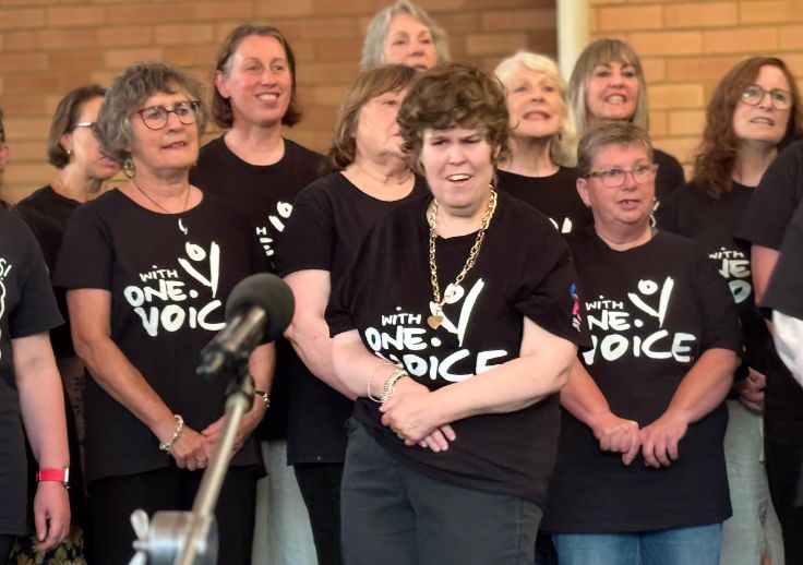 Aruma resident, Janette, performing in the With One Voice Choir. The event was filmed by channel nine.